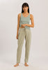 Full-body view of a women model wearing HA green tea cotton Tank Top