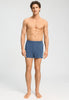 Full-body view of a men model wearing HA tanzanite melange modal/viscose/tencel Boxers
