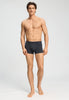 Full-body view of a men model wearing HA charcoal melange modal/viscose/tencel Pants