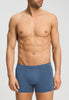 Front view of a men model wearing HA tanzanite melange modal/viscose/tencel Pants