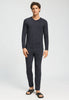 Full-body view of a men model wearing HA charcoal melange modal/viscose/tencel Long Pants