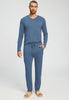 Full-body view of a men model wearing HA tanzanite melange modal/viscose/tencel Long Pants