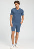 Full-body view of a men model wearing HA tanzanite melange modal/viscose/tencel S/SLV Shirt V-Neck