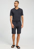 Full-body view of a men model wearing HA charcoal melange modal/viscose/tencel Short Pants