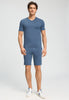 Full-body view of a men model wearing HA tanzanite melange modal/viscose/tencel Short Pants