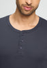 Close-up view of a men model wearing HA stormy gray cotton L/SLV Henley Shirt