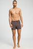 Full-body view of a men model wearing HA libra stripes cotton Boxers