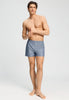 Full-body view of a men model wearing HA chambray blue cotton Boxers