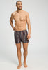 Full-body view of a men model wearing HA pinecone stripes cotton Boxers