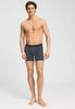Full-body view of a men model wearing HA stormy gray modal/viscose/tencel Shortleg Pants