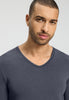 Close-up view of a men model wearing HA stormy gray modal/viscose/tencel L/SLV Shirt V-Neck