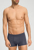 Front view of a men model wearing HA stormy gray modal/viscose/tencel Pants