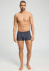 Full-body view of a men model wearing HA stormy gray modal/viscose/tencel Pants