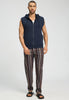 Full-body view of a men model wearing HA deep navy cotton Zippered vest