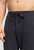 Close-up view of a men model wearing HA smokey charcoal cotton Long Pants