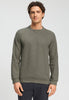 Front view of a men model wearing HA smokey olive cotton Pullover