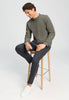 Full-body view of a men model wearing HA smokey olive cotton Pullover