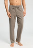 Front view of a men model wearing HA earthy woven cotton Long Pants