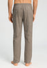 Back view of a men model wearing HA earthy woven cotton Long Pants