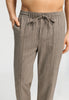 Close-up view of a men model wearing HA earthy woven cotton Long Pants