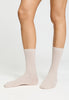 Front view of a women model wearing HA light linen wool Socks