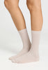 Back view of a women model wearing HA light linen wool Socks