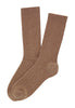 General view of a women model wearing HA canyon brown wool Socks