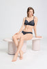 Full-body view of a women model wearing HA deep navy modal/viscose/tencel Mini Briefs