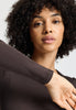 Close-up view of a women model wearing HA dark mocha cotton L/SLV Shirt