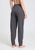 Back view of a women model wearing HA dark sesame cotton Long Pants