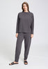Full-body view of a women model wearing HA dark sesame cotton Pullover
