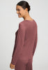 Back view of a women model wearing HA apple butter modal/viscose/tencel L/SLV Shirt