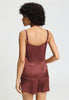 Back view of a women model wearing HA apple butter silk Spaghetti Top