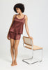 Full-body view of a women model wearing HA apple butter silk Spaghetti Top