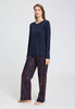 Full-body view of a women model wearing HA deep navy cotton L/SLV Shirt