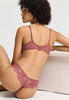 Close-up view of a women model wearing HA apple butter microfibre Thong