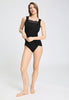 Full-body view of a women model wearing HA phantom wool Tank Top