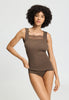 Front view of a women model wearing HA natural teak wool Tank Top