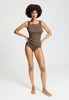 Full-body view of a women model wearing HA natural teak wool Tank Top