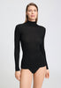 Front view of a women model wearing HA phantom wool Turtle-Neck Shirt