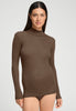 Front view of a women model wearing HA natural teak wool Turtle-Neck Shirt