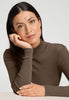Close-up view of a women model wearing HA natural teak wool Turtle-Neck Shirt