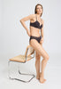 Full-body view of a women model wearing HA dark mocha cotton Mini Briefs