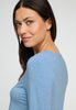 Close-up view of a women model wearing HA bluebird melange modal/viscose/tencel L/SLV Pajama