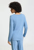 Back view of a women model wearing HA bluebird melange modal/viscose/tencel L/SLV Shirt