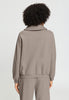 Back view of a women model wearing HA rose grey cotton Cardigan
