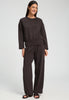 Full-body view of a women model wearing HA dark mocha cotton Long Pants