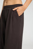 Close-up view of a women model wearing HA dark mocha cotton Long Pants