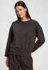 Front view of a women model wearing HA dark mocha cotton Sweatshirt
