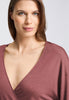 Close-up view of a women model wearing HA apple butter modal/viscose/tencel L/SLV Shirt